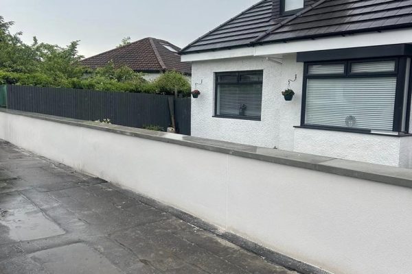 white fencing on the front of a house